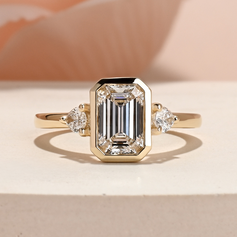 Modern Bezel Three Stone Emerald & Pear