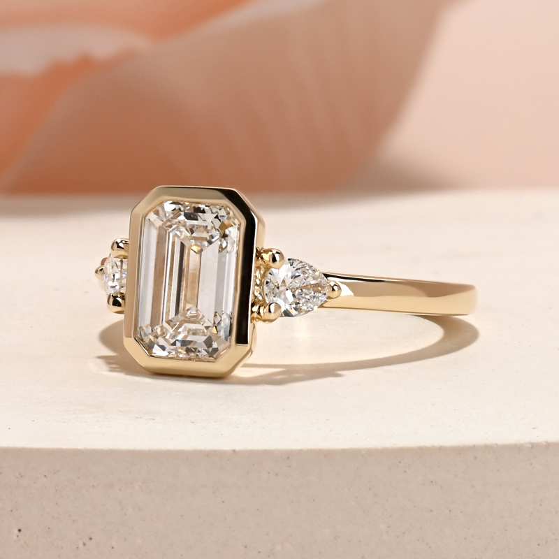 Modern Bezel Three Stone Emerald & Pear